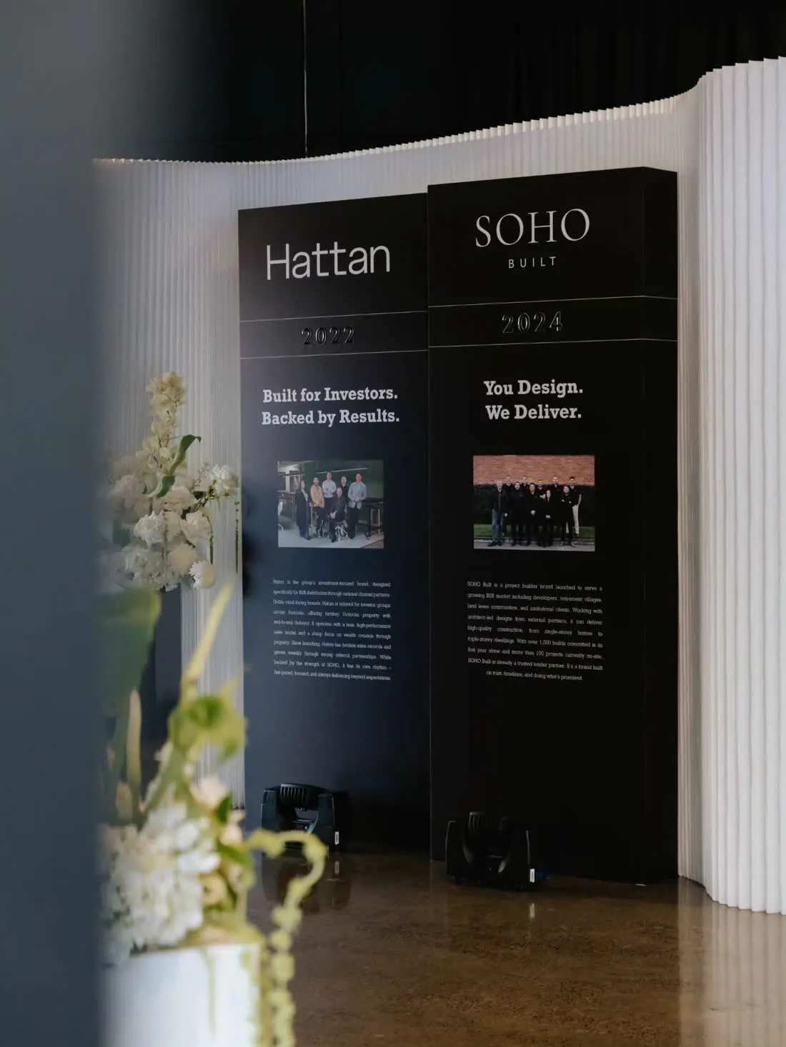 Large-format branded wall graphics at a corporate display