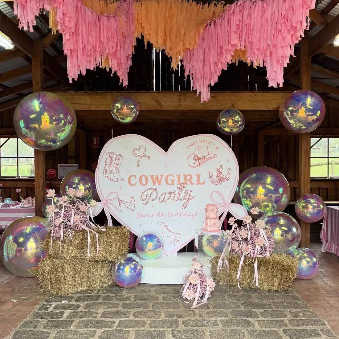 Heart-shaped cowgirl party standee with printed props